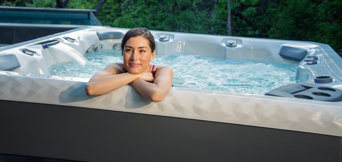 A MasterSpas Twilight hot tub in a backyard.