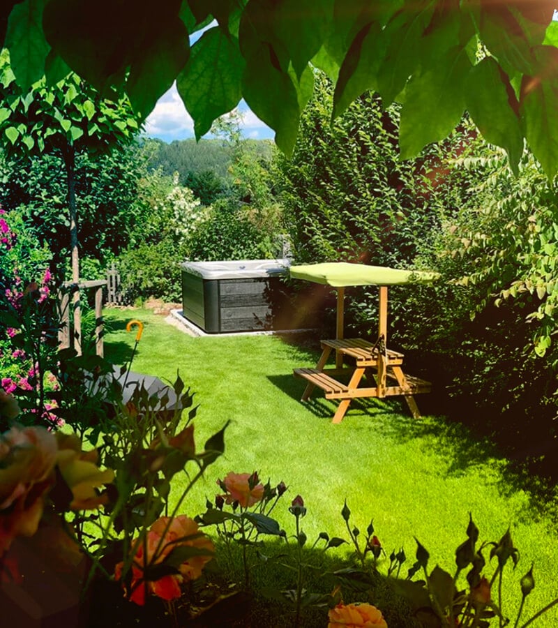 Mature bushes and trees offer a sense of privacy around the spa
